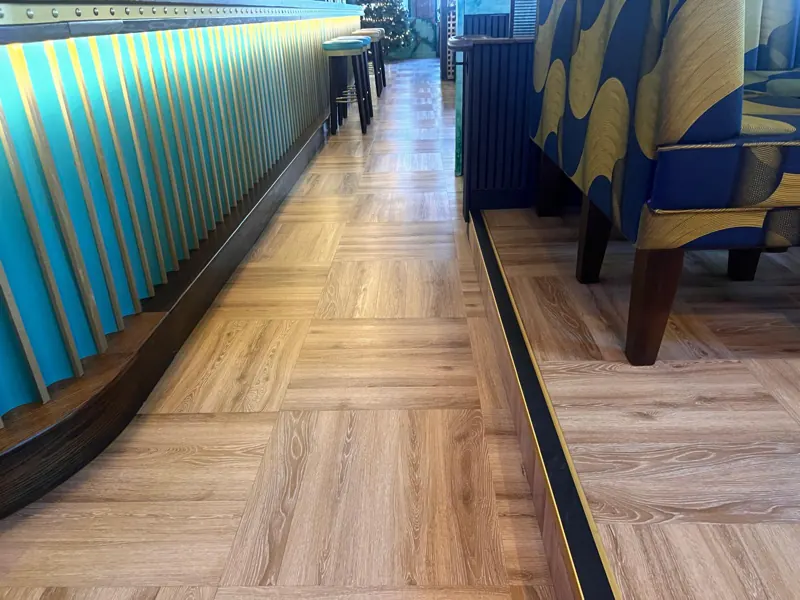 Step edge along the raised seating finished with a contrasting nosing