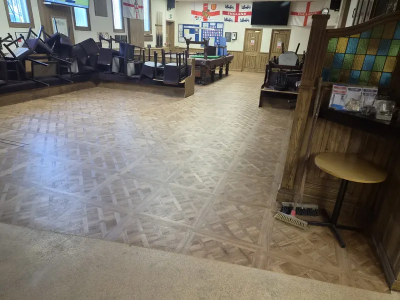 The Versailles pattern running from the bar into the room