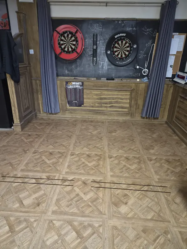 The oche marked in the new floor in front of the darts boards