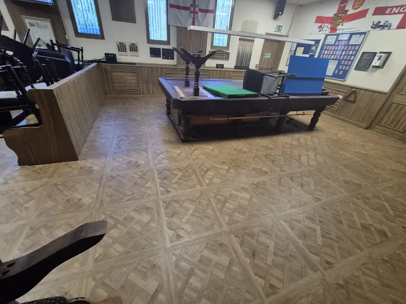 Versailles-pattern LVT round the snooker table and seating