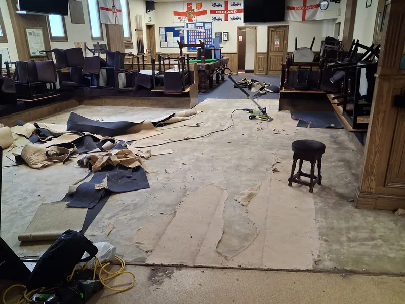 The old carpet coming up