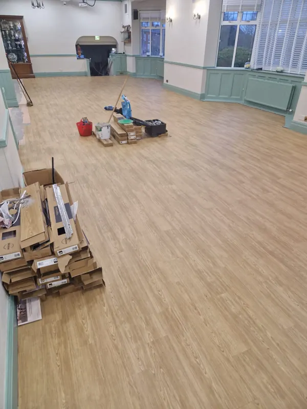 Finished floor with the last boxes being cleared