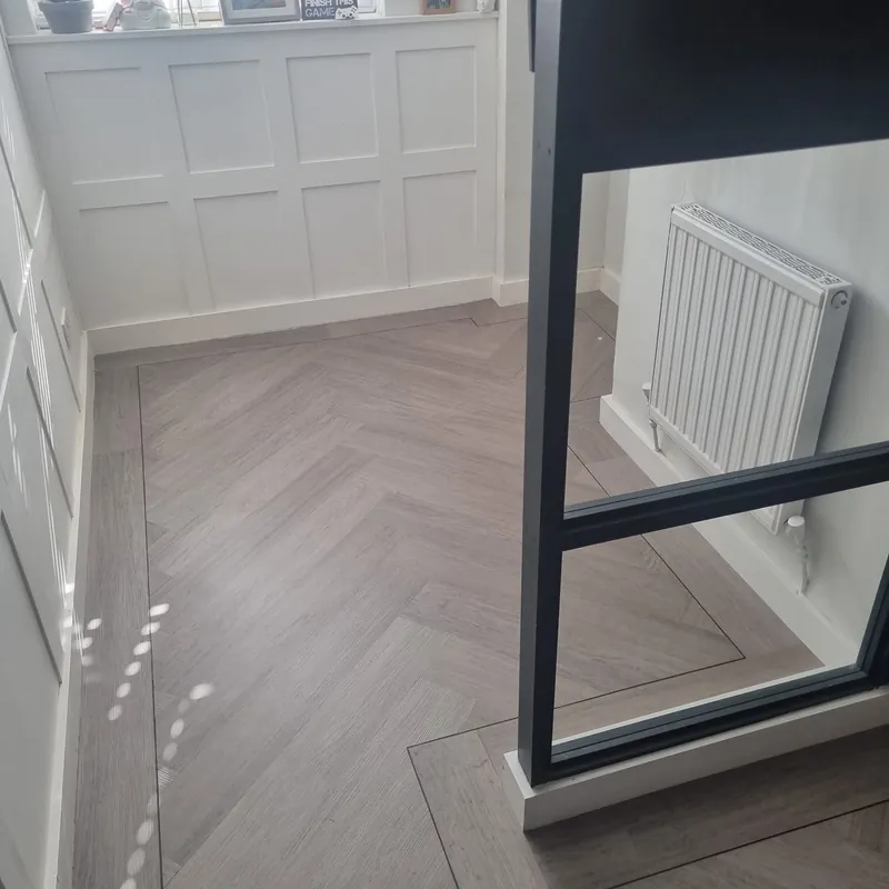 Grey herringbone LVT in the hallway