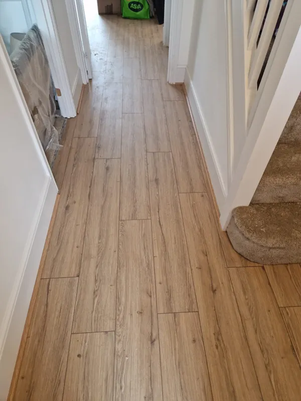 Wood-effect planks down a hall
