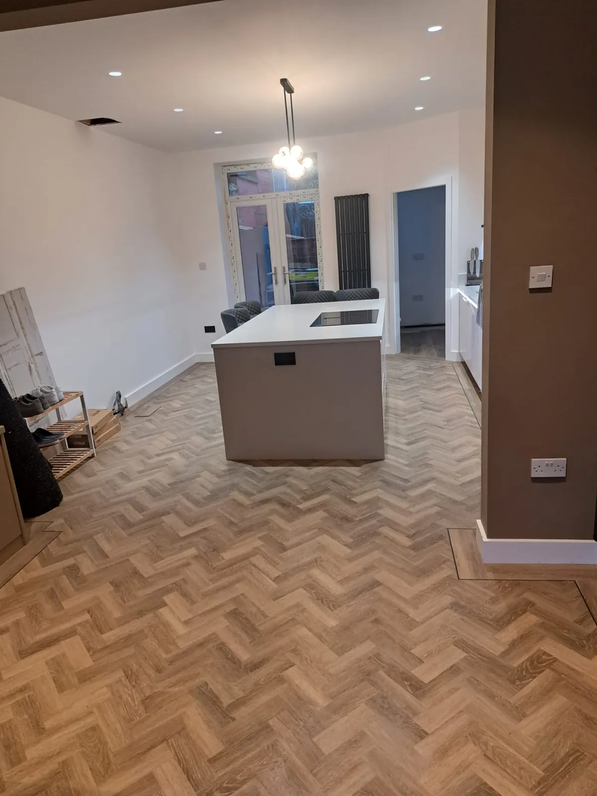 Amtico herringbone through the open-plan kitchen