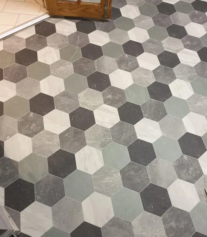 Mixed grey and green hexagon tiles in the hall