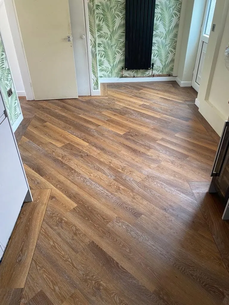 Oak plank LVT laid on the angle in the hallway