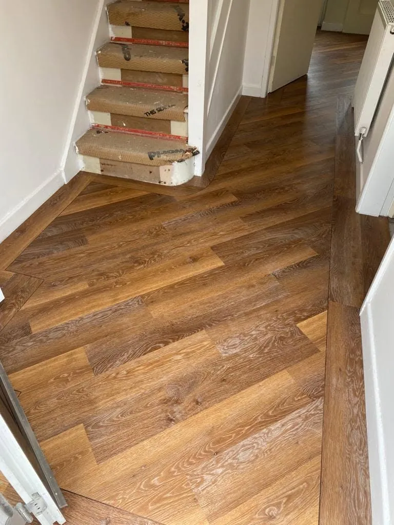 Hallway floor finished at the foot of the stairs