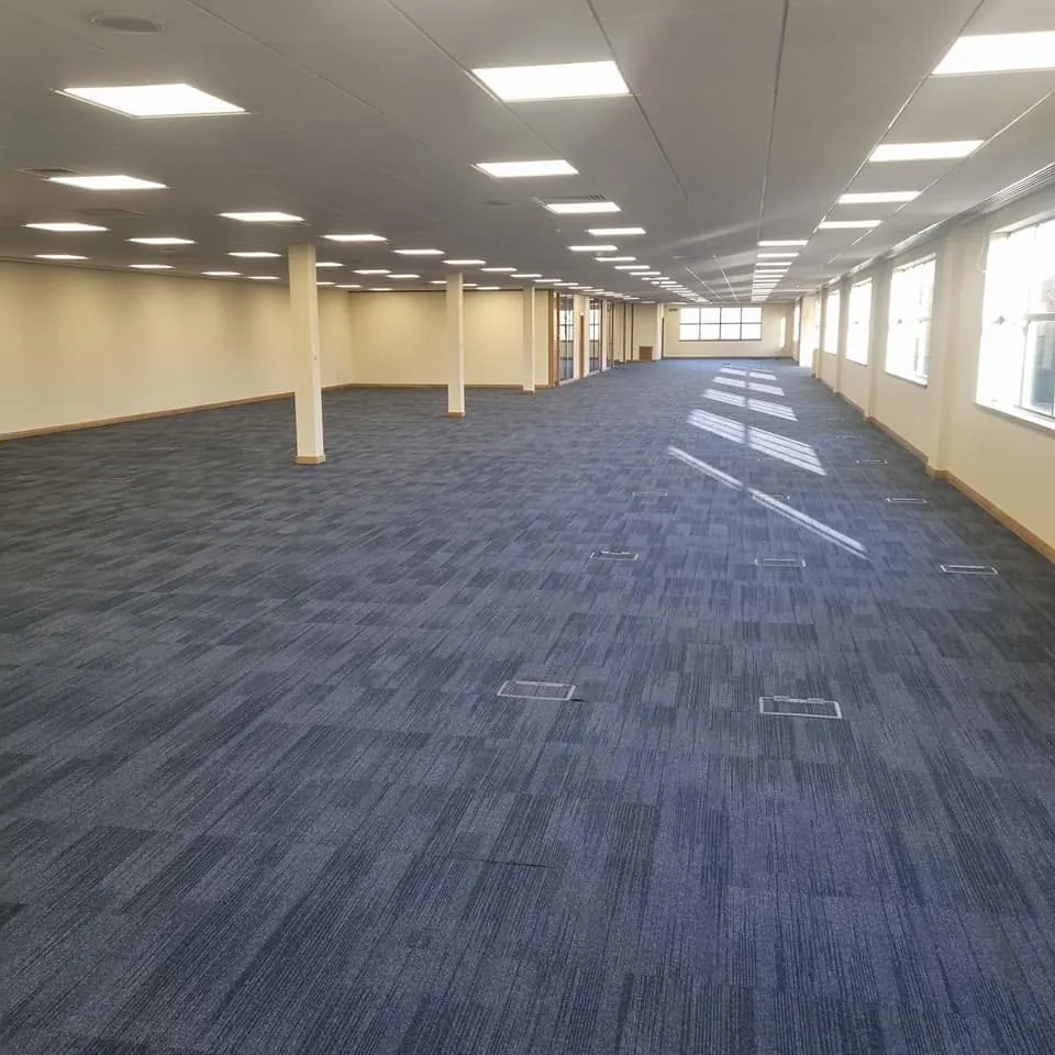 Open-plan office in navy carpet tiles