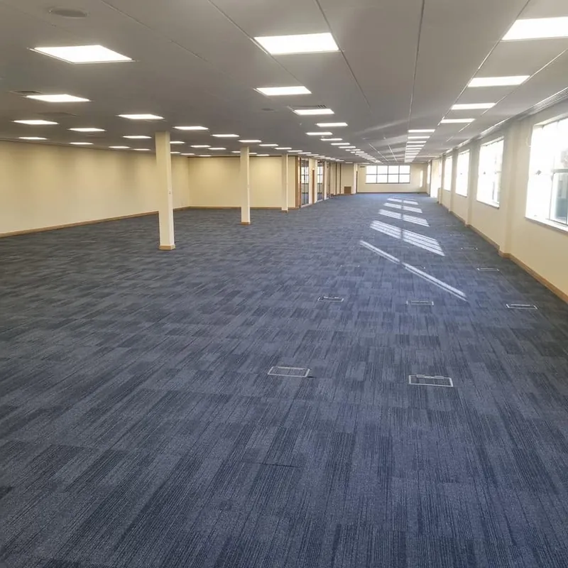 Open-plan office in navy carpet tiles