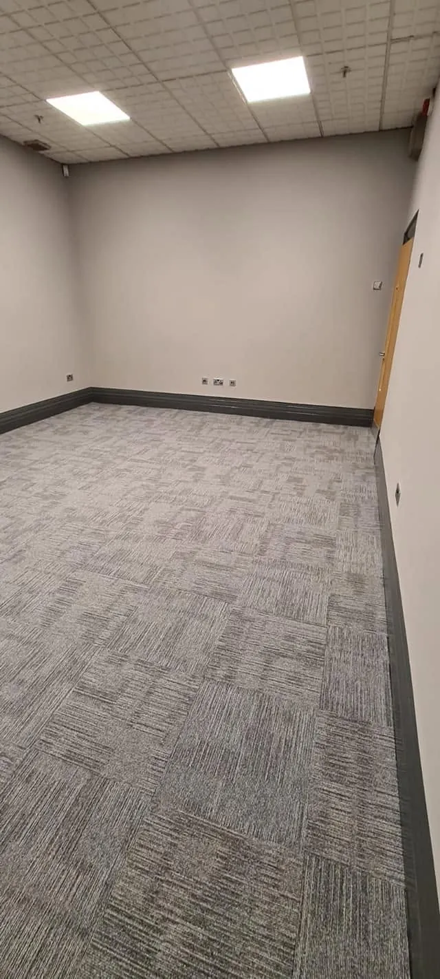 Office room in grey carpet tiles