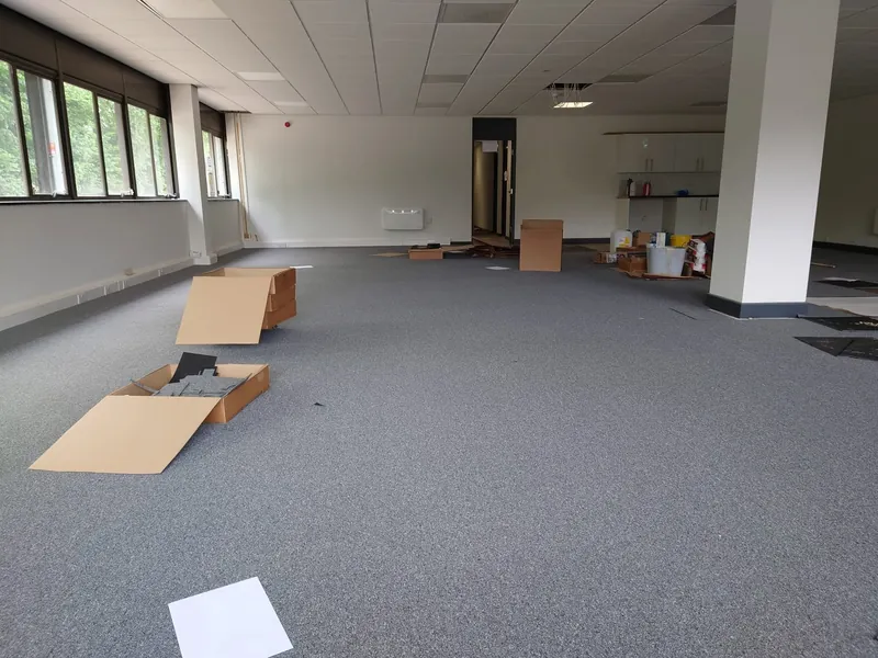 Open-plan office in grey carpet tiles