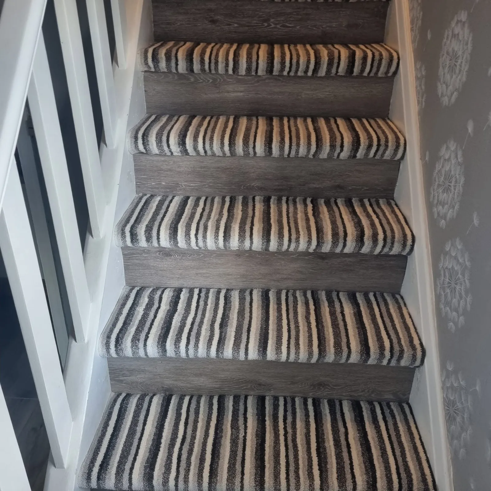 Striped carpet up the staircase